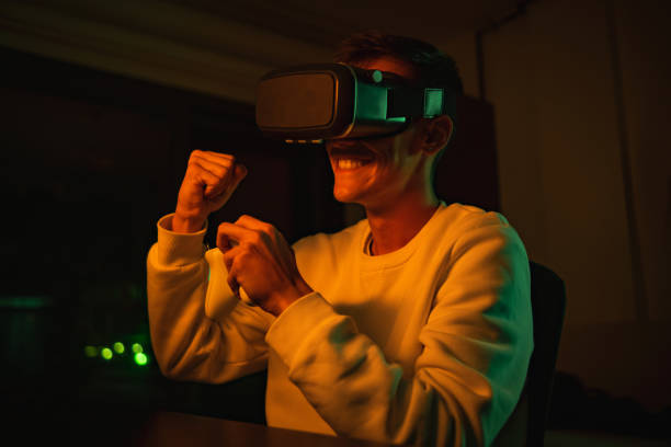 istock young man in vr glasses plays virtual reality game in metaverse universe and experiences different emotions 1438500180
