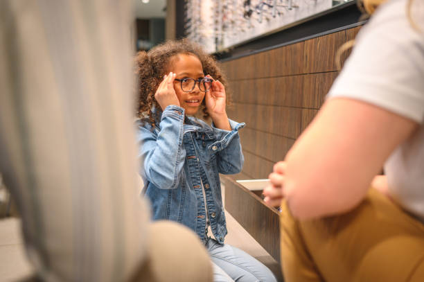 istock Curious Female Child Seeing Though Eyeglasses for the First Time 1438502613