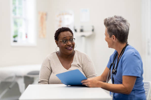 istock Patient discusses with nurse 1438502931