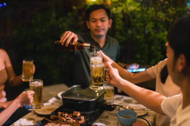 istock Asian friends together at home have dinner 1438503006