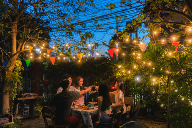 istock Evening group of friends drinking beer and clinking glasses. 1438503161