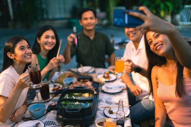 istock Asian friends together at home have dinner 1438504257