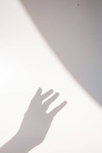 istock Aesthetic shadow of hand in the wall 1438506085