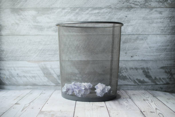istock crumpled paper ball in a bin top view 1438508296