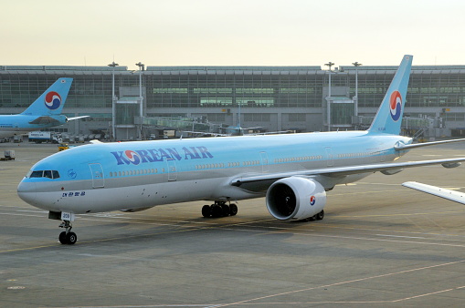 Seoul, South Korea- February 8, 2011: Seoul Incheon International Airport is a transportation Hub in Northeast Asia. Here is a Boeing 777 airplane of Korean Air in this airport.