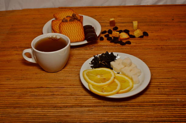 tea lemon sweets on wooden cane background 2