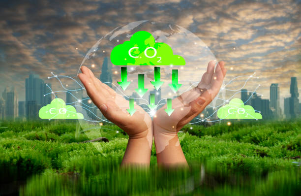 istock CO2 emission reduction concept.Hand with CO2 environmental icon. Global warming. Sustainable development. Solar Energy and Green Business Renewable energy green Future Sustainability ESG 1438524330
