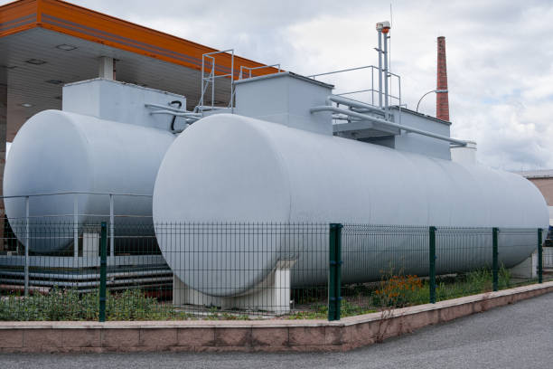 istock Horizontal cylindrical storage tank container for gas patrol. gray colored Outdoor Storage tank on Fuel station 1438524765