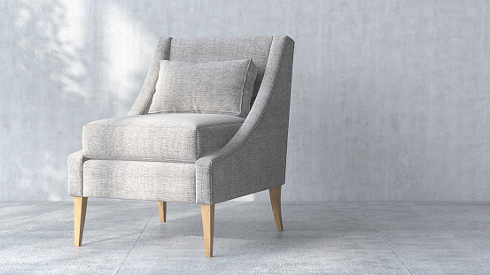 White gray modern fabric armchair with wooden leg and cushion in blank concrete wall room with cement tile floor in dappled sunlight from window for interior decoration, lifestyle and architecture product display