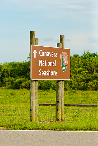 Titusville, Florida, USA - May 29, 2020: A National Park Service sign directs visitors to Canaveral National Seashore at NASA’s Kennedy Space Center.