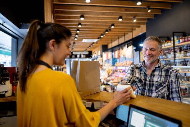 istock Man making a contactless payment at the supermarket 1438530510