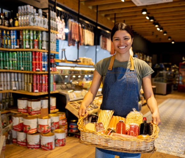 istock Happy retail clerk working at a charcuterie 1438530581