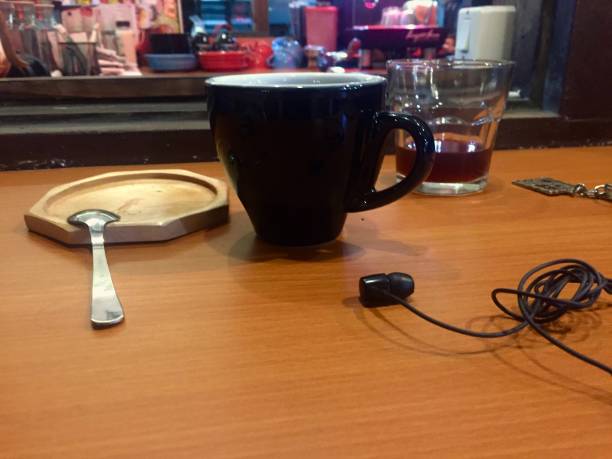 istock two cups of coffee and earphones 1438536623