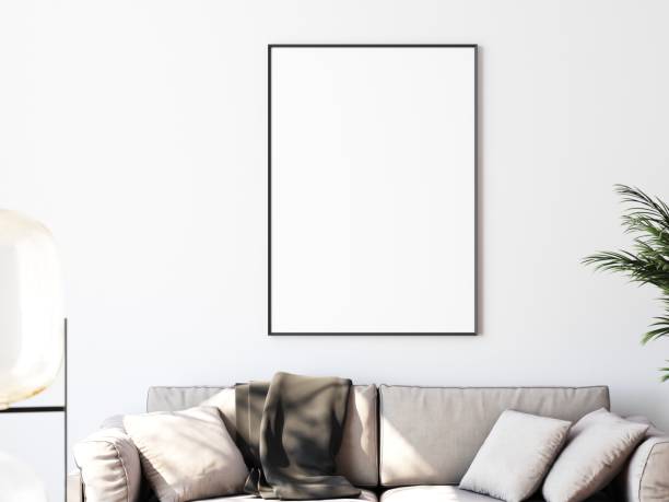 istock Single vertical oriented blank picture with thin black border hanging on white wall in living room. Place for your content. 3D illustration. 1438540743
