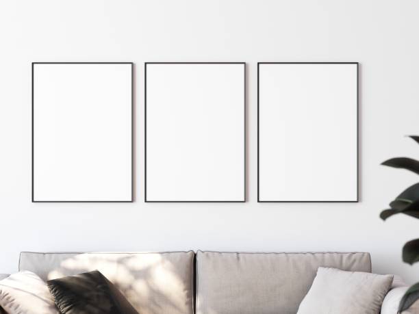 istock Row of three picture frames hanging on white wall above sofa. Place for your content. 3D illustration. 1438540745