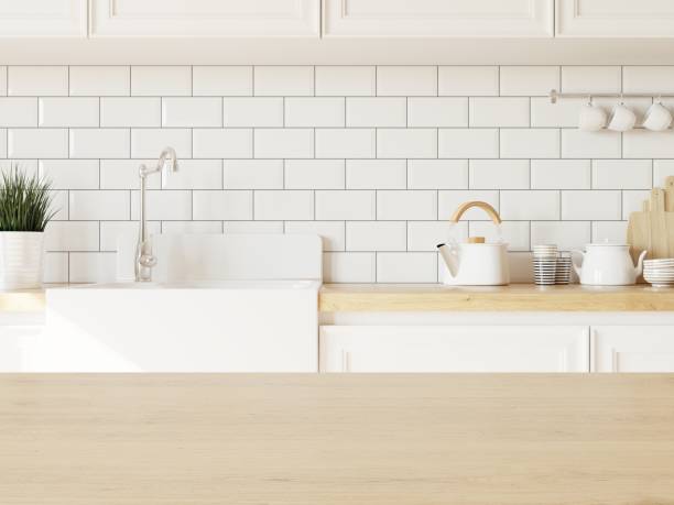 istock Empty wooden desk in kitchen for displaying your product. Dishes on kitchen counter. 3D illustration. 1438540938