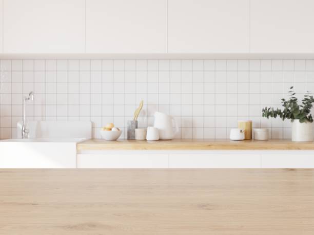 istock Empty wooden desk in home interior. Kitchen with white tiled wall in background. 3D illustration. 1438541525