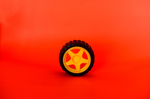 Toy Car Wheel on red backround