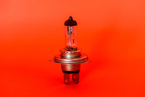 The image of a headlight lamp under a red background