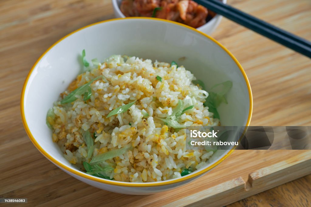 Fried Rice with Eggs and Chinese Onion Fired rice with eggs and Chinese onion is very popular cooking for household cuisine. Almost every family can cook this meal in China. Fried Rice Stock Photo