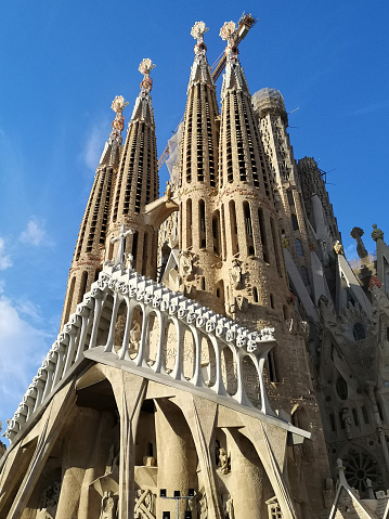 Majestic facade of la Sagrada Família, a church in the Eixample district of Barcelona, Catalonia. Designed by the Catalan architect Antoni Gaudí (1852–1926), his work on Sagrada Família is part of a UNESCO World Heritage Site. Spain