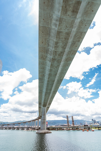 Cruising underneath the CCLEX bridge, a large cable-stayed bridge, part of the CebuCordova Link Expressway.