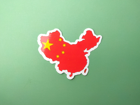 China flag stickers on a green background.