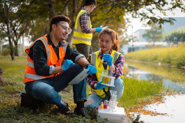 Scientists team collect water samples for analysis and research on water quality, environment with saving earth. Scientists team collect water samples for analysis and research on water quality, environment with saving earth. ecologist stock pictures, royalty-free photos & images