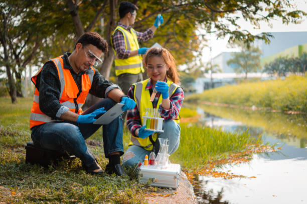 istock Scientists team collect water samples for analysis and research on water quality, environment with saving earth. 1438553050