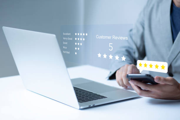 istock Satisfaction and customer service survey concept, business people using  laptop and smartphone. to answer the questionnaire And the satisfaction rating, the satisfaction rating with the icon 5 stars. 1438553676