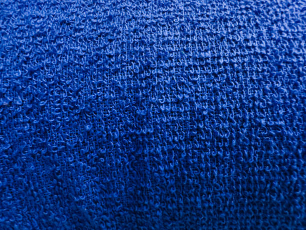 istock Blue color fabric texture with micropores. macro 1438557440