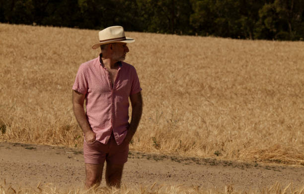 istock Adult man in hat in wheat field 1438561068
