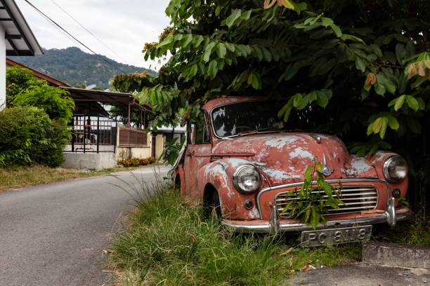 Georgetown, Malaysia – December 10, 2019: Abandoned Car in Georgetown, Malaysia. Photograph taken in December 2019