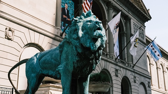 Chicago, United States – July 30, 2022: A scenic view of the bronze lion statue outside the Art Institute of Chicago in USA