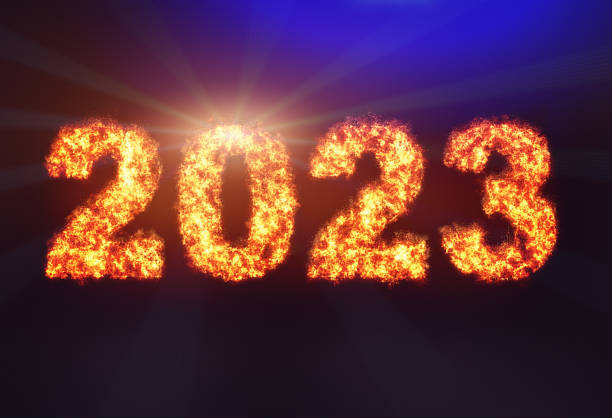 fire spells out the year 2023 in flaming numbers - 0 3 months imagens e fotografias de stock