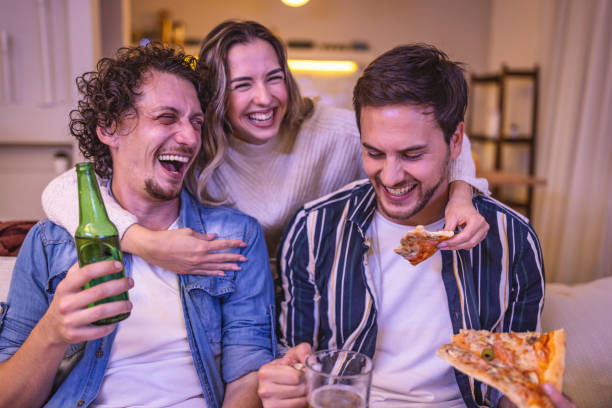 istock Friends watching soccer game on TV 1438563233