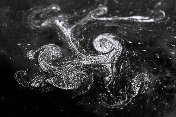 istock Abstract multicolored drawing with paints on the water. 1438565919