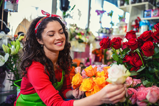 Woman Working with flowers in a flower shop.