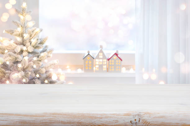 istock Christmas table top in front of blurred decorated window background 1438567814