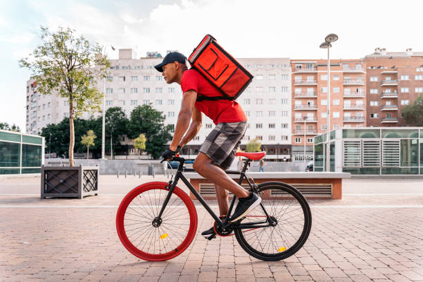 istock African Delivery Man Riding Bike 1438569298