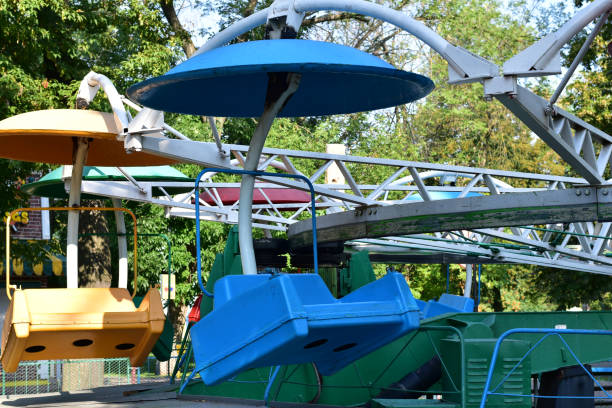 istock Armchairs of different colors, carousel attraction. 1438569502