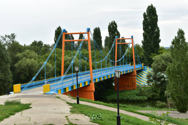 istock A blue metal bridge connecting the two banks. 1438569655