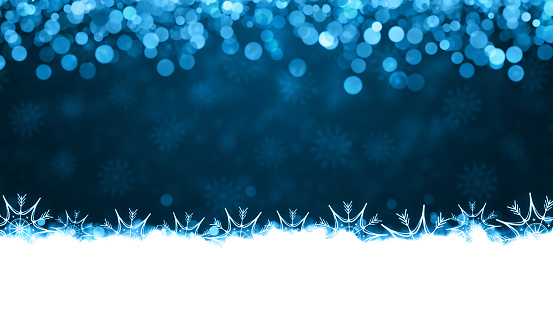 White colored snow and illuminated glowing snowflakes at the bottom edges or border of a dark blue horizontal backgrounds. Can be used as Xmas , New Year day celebrations background, wallpapers, gift wrapping sheets, posters, banners and greeting cards. Small glitter like or glittery dots shining at the top edge.