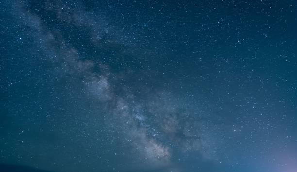 istock Nebulas and galaxies in the dark starry sky 1438571892