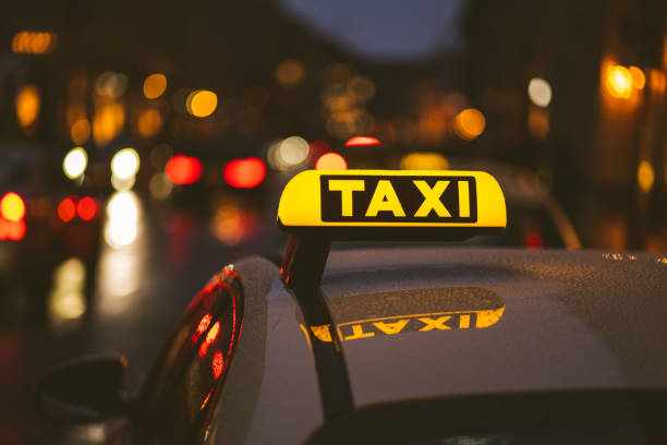 istock Taxi sign on car during night 1438572014