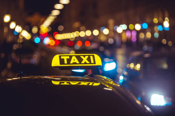 istock Taxi sign on car during night 1438572251