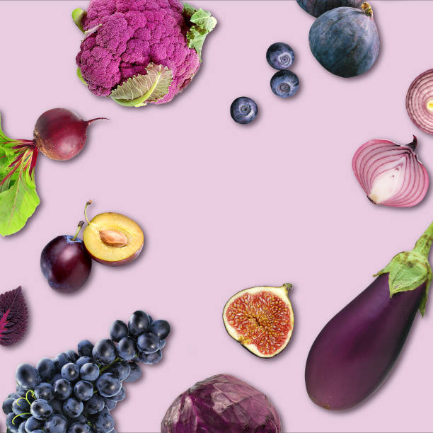 istock Creative layout made of red cabbage, eggplant, onion, basil, fig, cauliflower, blueberry, plum, grape, beetroot, blackberry on the purple background. 1438572607