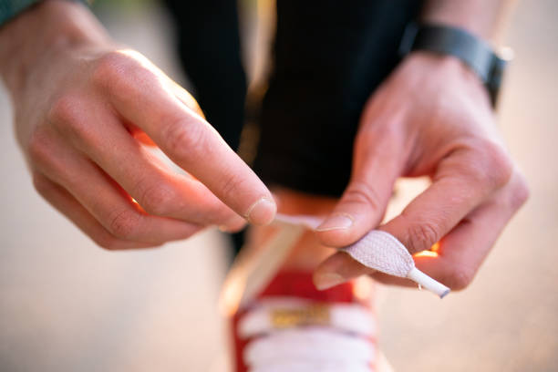 The laces feature a contrasting center stitch made of black or dark grey threads, creating a visible pattern.
