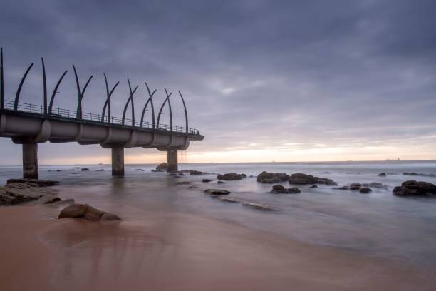 istock Bridge on the sea with a sunset background 1438573700