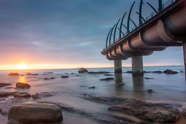 istock Bridge on the sea with a sunset background 1438573710